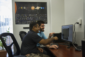Reddy and Campbell examine their animation of a Chinese space station flyby. (Photo: Mari Cleven/UA Research, Discovery & Innovation) Reddy and Campbell examine their animation of a Chinese space station flyby. (Photo: Mari Cleven/UA Research, Discovery & Innovation)